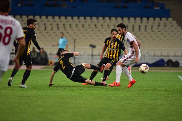 Italy: AEK versus Milan Michalis Bakakis (no 2) of AEK, stops the attack of Hakan Calhanoglu (no 10) of Milan. Athens Attiki Greece OAKA Spiros Louis  DimitriosxKarvountzisx xPacificxPress