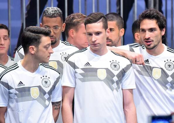 adidas presents DFB jerseys for World Cup 2018 Football 07 11 2017 vl Mesut Oezil FC Arsenal London Jerome Boateng Bayern Munich Julian Draxler Paris Saint Germain Mats Hummels FC Bayern Muenchen presents the new jersey of the German national football team Presentation of the new jersey of the national team for the 2018 World Cup in Russia The BASE Berlin Uferhallen Football 07 11 2017 xDLx