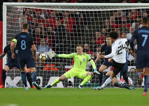 Themen der Woche - SPORT 10th November 2017, Wembley Stadium, London, England; International football friendly, England versus Germany; Goalkeeper Jordan Pickford of England saving a shot by Leroy Sane of Germany  ActionPlus11949216