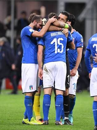 Football International World Cup 2018 Play Off Rueckspiel in Milan 13 11 2017 Italy Sweden Emttaeuschung Italy After the Game Goalkeeper Gianluigi Buffon right embraces Andrea Barzagli centre and Giorgio Chiellini left Milan