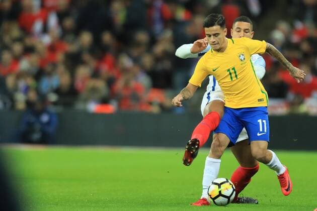 14th November 2017, Wembley Stadium, London, England; International football friendly, England versus Brazil; Philippe Coutinho of Brazil is challenged by Jake Livermore of England  ActionPlus11951249