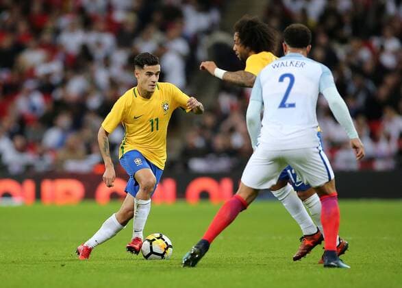 14th November 2017, Wembley Stadium, London, England; International football friendly, England versus Brazil; Philippe Coutinho of Brazil takes on Kyle Walker of England  ActionPlus11951270