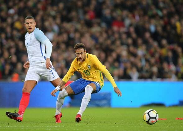 14th November 2017, Wembley Stadium, London, England; International football friendly, England versus Brazil; Neymar of Brazil crosses the ball into the England box, as Jake Livermore of England watches on  ActionPlus11951276