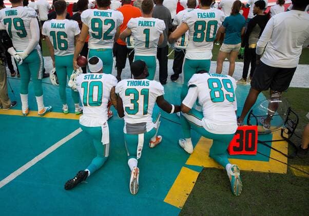 November 19, 2017 - Florida, U.S. - LOREN ELLIOTT Times .Miami Dolphins wide receiver Kenny Stills (10), free safety Michael Thomas (31) and tight end Julius Thomas (89) kneel during the national anthem before an NFL American Football Herren USA game between the Tampa Bay Buccaneers and Miami Dolphins at Hard Rock Stadium in Miami Gardens, Fla., on Sunday, Nov. 19, 2017. NFL 2017: Dolphins 20:30 Buccaneers - ZUMAs70_ 20171119_zan_s70_011 Copyright: xLorenxElliottx