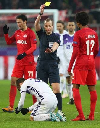 MOSCOW, RUSSIA - NOVEMBER 21, 2017: Spartak Moscow s Luiz Adriano (R front) receives a yellow card in the 2017 UEFA Champions League Group E football match between Spartak Moscow and Maribor at Otkrytiye Arena (Spartak Stadium); front crouching: Maribor s Damjan Bohar; the match ended in a 1-1 draw. Anton Novoderezhkin TASS  TS06A029