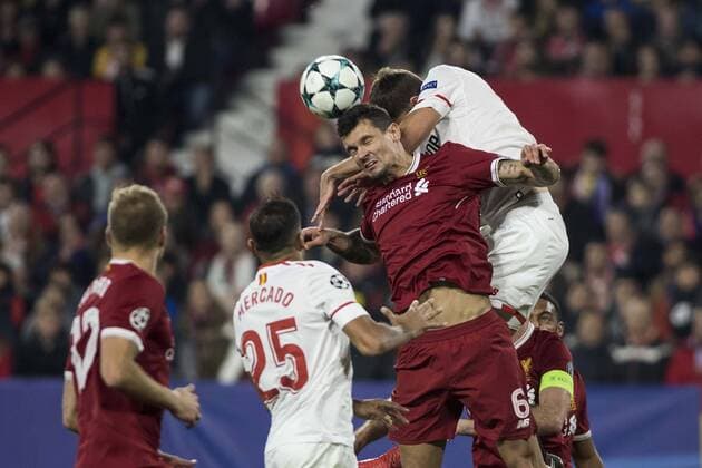 November 21, 2017 - Seville, Spain - DEJAN LOVREN of Liverpool (C ) vies for the ball with CLEMENT LENGLET of Sevilla ( R) during the UEFA Champions League Group E soccer match between Sevilla FC and Liverpool FC at Estadio Ramon Sanchez Pizjuan Soccer 2017 - Sevilla FC vs Liverpool FC - ZUMAa142 20171121_zap_a142_030 Copyright: xDanielxGonzalezxAcunax