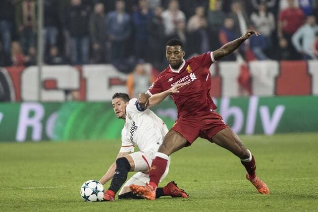 November 21, 2017 - Seville, Spain - SERGIO ESCUDERO of Sevilla (L ) vies for the ball with GEORGINA WIJNALDUM of Liverpool (R) during the UEFA Champions League Group E soccer match between Sevilla FC and Liverpool FC at Estadio Ramon Sanchez Pizjuan. UEFA Soccer 2017: Sevilla 3:3 Liverpool - ZUMAa142 20171121_zap_a142_013 Copyright: xDanielxGonzalezxAcunax