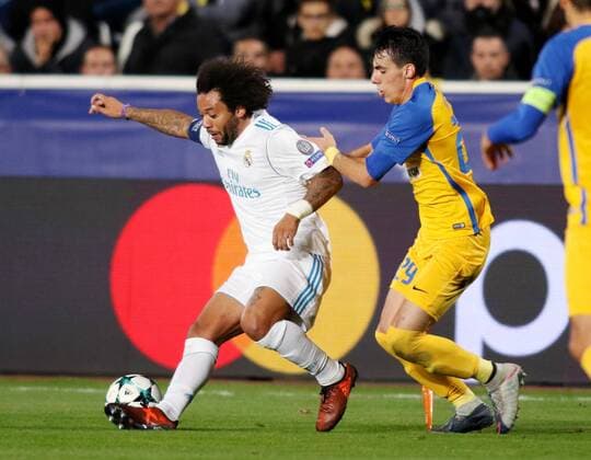 (171122) -- NICOSIA, Nov. 22, 2017 -- Real Madrid s Marcelo (L) vies for the ball during the the UEFA Champions League Group H match against Apoel in Nicosia, Cyprus, Nov. 21, 2017. Real Madrid won 6-0. ) (SP)CYPRIS-NICOSIA-SOCCER-UEFA CHAMPIONS LEAGUE-REAL MADRID VS APOEL SakisxSavvides 