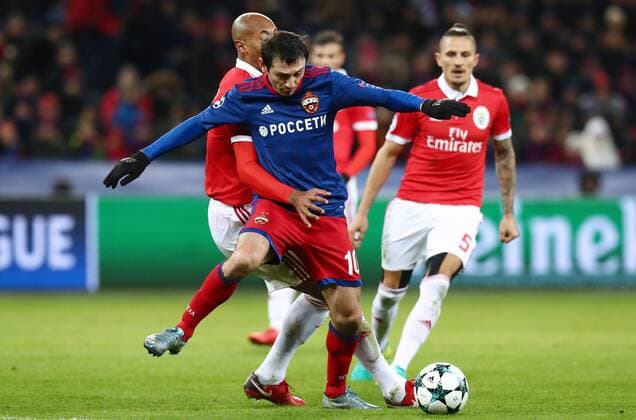 MOSCOW, RUSSIA â€“ NOVEMBER 22, 2017: CSKA Moscow s Alan Dzagoyev (front) and Benfica Lisbonâ€™s Luisao (L) in their 2017 18 UEFA Champions League Group A Round 5 football match at VEB Arena; CSKA won 2-0. Stanislav Krasilnikov TASS  TS06A2E9