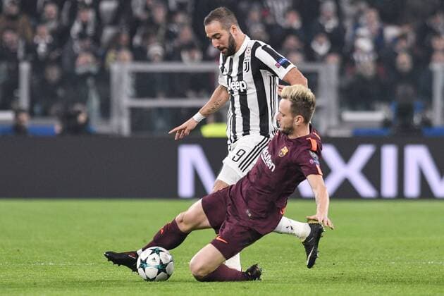 Gonzalo Higuain of Juventus is challenged by Ivan RakitiÄ‡ of Barcelona during the UEFA Champions League match between Juventus and Barcelona at the Juventus Stadium, Turin, Italy on 22 November 2017. Copyright: xGiuseppexMaffiax 17830007