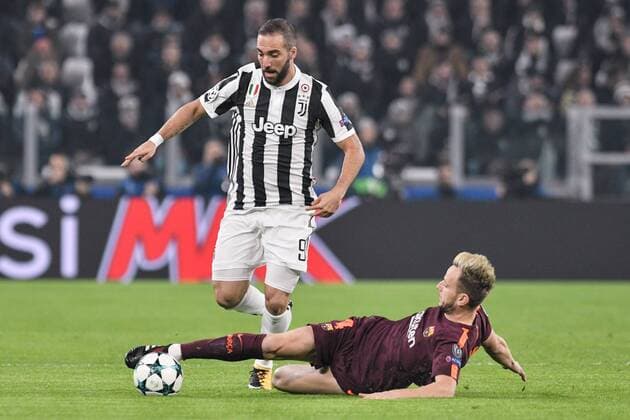 November 22, 2017 - Turin, Italy - Ivan RakitiÄ¡ of Barcelona challenges Gonzalo HiguaoÂ­n of Juventus during the UEFA Champions League match between Juventus and Barcelona at the Juventus Stadium, Turin, Italy on 22 November 2017. Juventus v Barcelona - UEFA Champions League  - ZUMAn230 20171122_zaa_n230_229 Copyright: xGiuseppexMaffiax