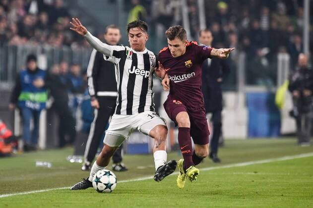 Paulo Dybala of Juventus is challenged by Lucas Digne of Barcelona during the UEFA Champions League match between Juventus and Barcelona at the Juventus Stadium, Turin, Italy on 22 November 2017. Copyright: xGiuseppexMaffiax 17830039