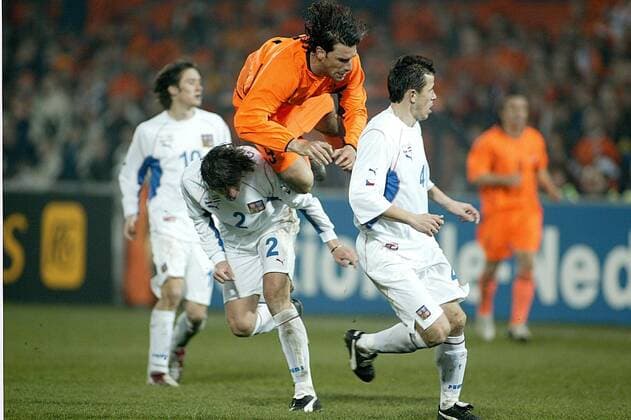 Rotterdam 29 03 2003 The Netherlands Czech Republic 1 1 qualification for Euro2004 ruud of nistelroove over the knee of zdenek grygea thomas galasek looks on the netherlands portugal football