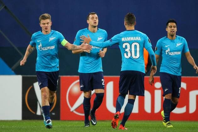 ST PETERSBURG, RUSSIA â€“ NOVEMBER 23, 2017: FC Zenit St Petersburg s Emiliano Rigoni, Artyom Dzyuba, Emanuel Mammana, and Christian Noboa (L-R) celebrate scoring in their UEFA Europa League Group L Round 5 football match against FK Vardar at Saint Petersburg Stadium. Alexander Demianchuk TASS  TS06A4E5