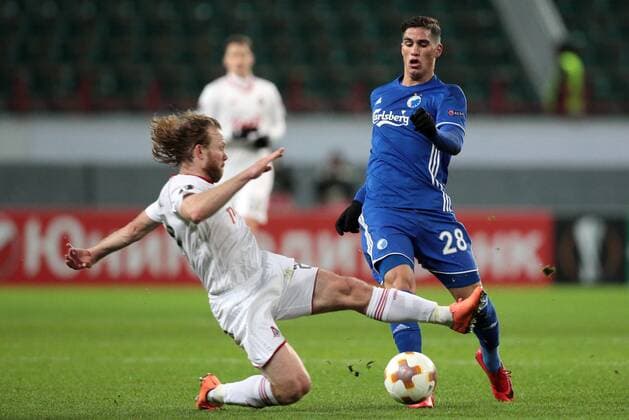 MOSCOW, RUSSIA â€“ NOVEMBER 23, 2017: Lokomotiv Moscow s Vitaly Denisov (L) and FC Copenhagen s Carlo Holse fight for the ball in their 2017-18 UEFA Europa League Group F Round 5 football match at RZD Arena Stadium. Sergei Bobylev TASS  TS06A4EC