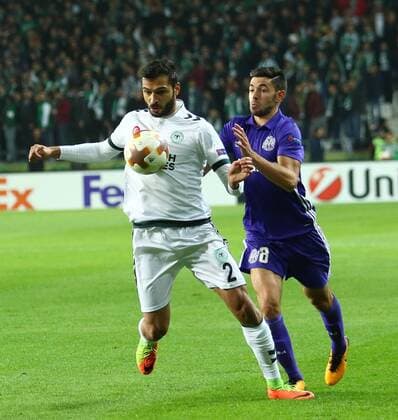 Volkan Findikli 2 of Konyaspor and Morgan Sanson 8 of Marseille during the UEFA Europa Match between Konyaspor and Marseille at Buyuksehir Stadium in Konya , Turkey on November 23 , 2017. 