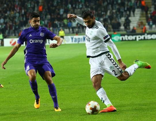 Volkan Findikli 2 of Konyaspor and Morgan Sanson 8 of Marseille during the UEFA Europa Match between Konyaspor and Marseille at Buyuksehir Stadium in Konya , Turkey on November 23 , 2017. 