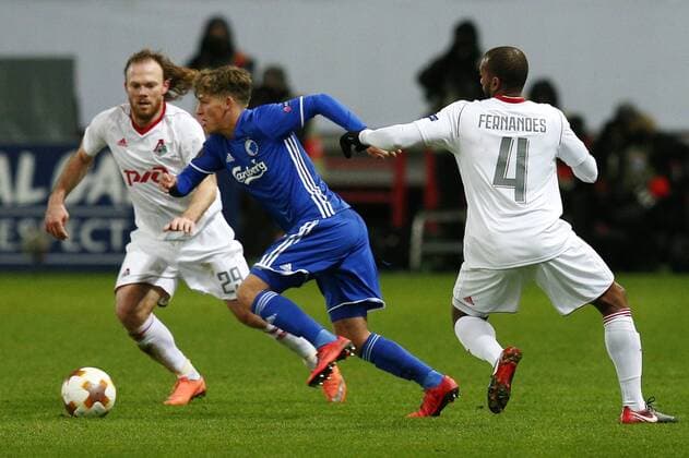 MOSCOW, RUSSIA â€“ NOVEMBER 23, 2017: Lokomotiv Moscow s Vitaly Denisov (L), Manuel Fernandes (R) and FC Copenhagen s Carlo Holse (C) fight for the ball in their UEFA Europa League Group F Round 5 football match at RZD Arena Stadium. Mikhail Tereshchenko TASS  TS06A503