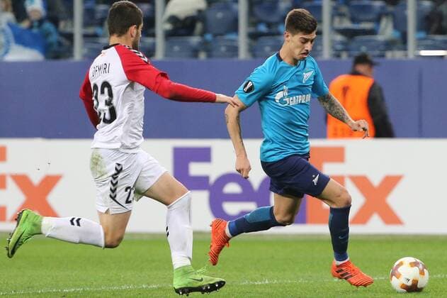 ST PETERSBURG, RUSSIA â€“ NOVEMBER 23, 2017: FK Vardar s Besir Demiri (L) and FC Zenit St Petersburg s Emiliano Rigoni fight for the ball in their 2017-18 UEFA Europa League Group L Round 5 football match at Saint Petersburg Stadium. FC Zenit St Petersburg won the game 2-1. Alexander Demianchuk TASS  TS06A52E