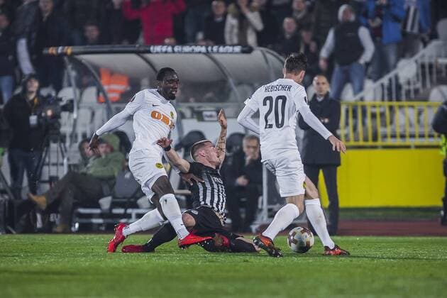 23rd November 2017, Partizan Stadium, Serbia, Belgrade; UEFA Europa League, Partizan versus Young Boys; Ognjen Ozegovic of Partizan goes down injured after the foul by Midfielder Yannick Toure and Michel Aebischer of Young Boys  ActionPlus11955148