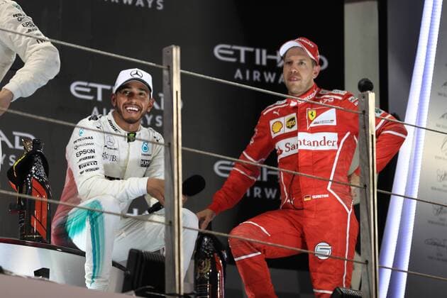 26th November 2017, Yas Marina Circuit, Abu Dhabi, UAE; Abu Dhabi Formula One Grand Prix, Sunday race day; Sebastian Vettel - Scuderia Ferrari speaks with Lewis Hamilton on the podium  ActionPlus11956634