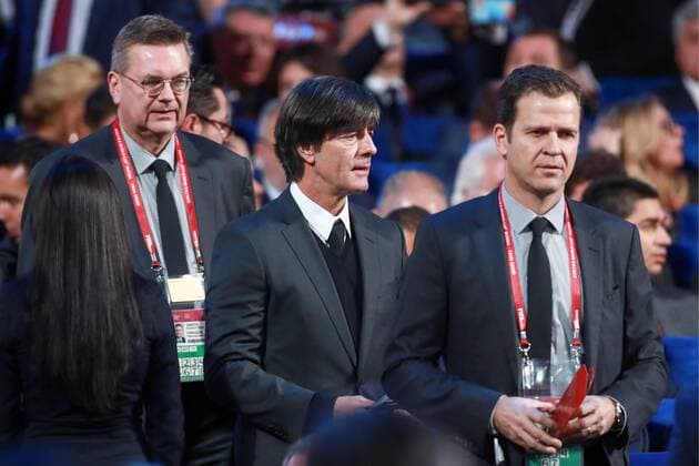 MOSCOW, RUSSIA - DECEMBER 1, 2017: German Football Association President Reinhard Grindel, Joachim Low and Oliver Bierhoff (L-R), head coach and business manager of the German national football team respectively, ahead of the 2018 FIFA World Cup WM Weltmeisterschaft Fussball final draw at the State Kremlin Palace. Sergei Fadeichev TASS  TS06B67A