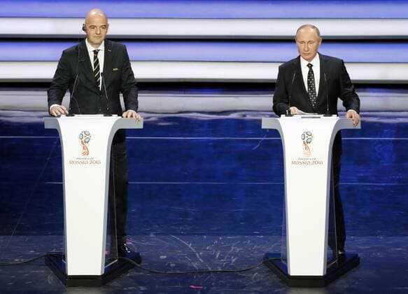 2018 World Cup draw Russian President Vladimir Putin (R) and FIFA President Gianni Infantino on stage at the concert hall of the State Kremlin Palace in Moscow on Dec. 1, 2017, during the draw for the 2018 soccer World Cup finals in Russia. 