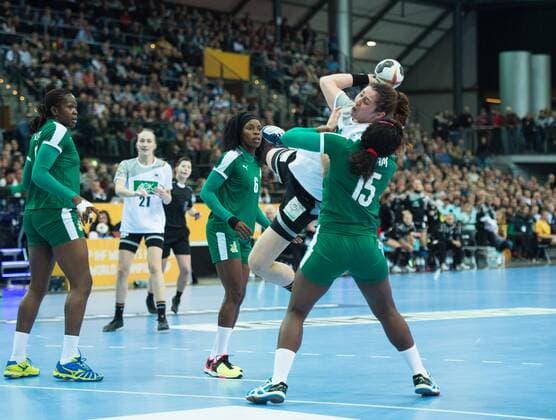 Jenny Karolius 6 GER in the circle against Anne Michelle Essam 15 CMR and Jacqueline Mossy Solle 6 Preliminary group match Germany Cameroon in Leipzig on 01 12 2017 Handball 23 Womens Handball World Cup in Germany 2017