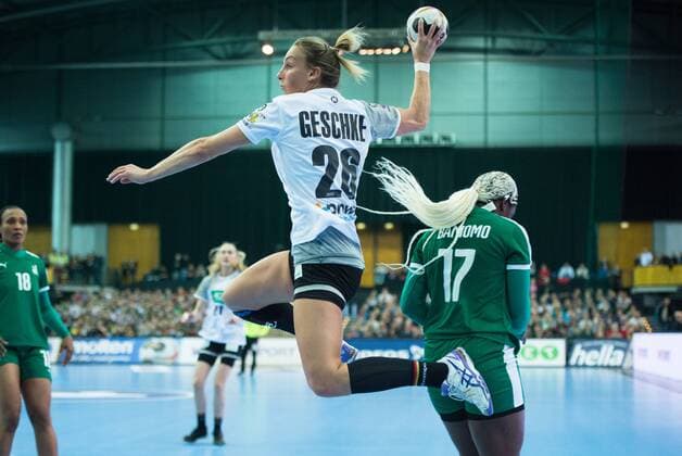 Angie Geschke 26 GER on the ball against Jacky Baniomo 17 CMR preliminary round Group match Germany Cameroon in Leipzig on 01 12 2017 Handball 23 Womens Handball World Cup in Germany 2017