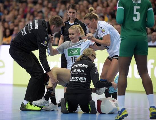 Kim Naidzinavicius GER 15 is worn by Angie Geschke GER 26 after an injury in the match Germany GER vs Cameroon CMR Handball Women World Cup Leipzig 01 12 2017 Leipzig Copyright: xModlax Eibner-Pressefotox EP_cma
