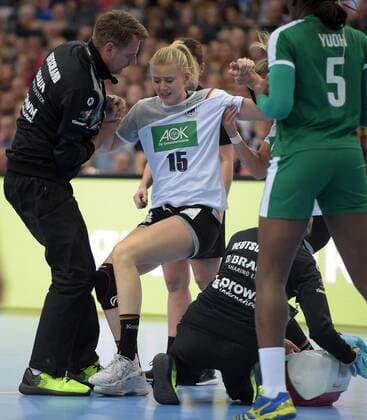 Kim Naidzinavicius GER 15 is worn by Angie Geschke GER 26 after an injury in the match Germany GER vs Cameroon CMR Handball Women World Cup Leipzig 01 12 2017 Leipzig Copyright: xModlax Eibner-Pressefotox EP_cma