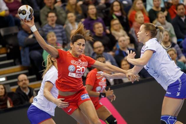 Oldenburg Niedersachsen DEU 02 12 2017 Mouna Chebbah Center Tunisia Club Chambrey les Tours FRA and Polina Vedekhina right Russia Club Lada Handball Women World Cup Germany 2017 Preliminary Group C Russia vs Tunisia Handball World Championship of Women Germany