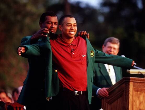Golf The Masters 2001 Vijay Singh helps Tiger Woods into the Green jacket Augusta Georgia U S A