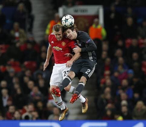 Luke Shaw of Manchester United ManU challenged by Mario Fernandes of CSKA Moscow during the Champions League Group A match at the Old Trafford, Manchester. Picture date: December 5th 2017. Picture credit should read: Andrew Yates Sportimage EDITORIAL USE ONLY. No use with unauthorised audio, video, data, fixture lists, club league logos or live services. Online in-match use limited to 120 images, no video emulation. No use in betting, games or single club league player publications.