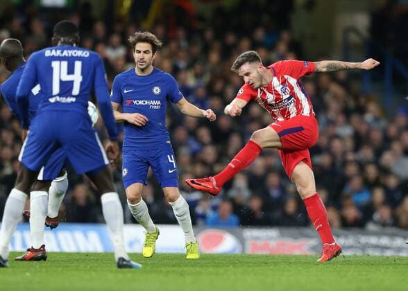 5th December 2017, Stamford Bridge, London, England; UEFA Champions League football, Chelsea versus Atletico Madrid; Saul Niguez of Atletico Madrid taking a shot past Ngolo Kante Tiemoue Bakayoko and Cesc Fabregas of Chelsea  ActionPlus11959272
