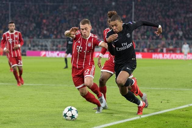 SOCCER - CL, Bayern vs PSG MUNICH,GERMANY,05.DEC.17 - SOCCER - UEFA Champions League, group stage, FC Bayern Muenchen vs Paris Saint-Germain FC. Image shows Joshua Kimmich (Bayern) and Kylian Mbappe (PSG). GEPAxpictures xMarkusxFischer