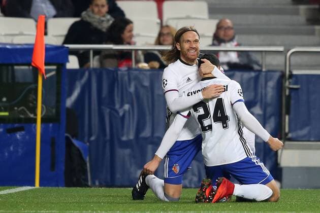December 5, 2017 - Lisbon, Portugal - Basel s midfielder Mohamed Elyounoussi from Norway celebrates with Basel s defender Michael Lang from Suisse (L ) after scoring a goal during the UEFA Champions League Group A football match between SL Benfica and FC Basel at the Luz stadium in Lisbon, Portugal on December 5, 2017. Photo: UEFA Champions League group A football match SL Benfica vs FC Basel - ZUMAf123 20171205_zap_f123_006 Copyright: xPedroxFiuzax