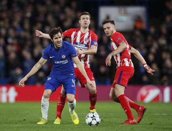 Cesc Fabregas of Chelsea is fouled by Gabi of Atletico Madrid during the Champions League Group C match at the Stamford Bridge, London. Picture date: December 5th 2017. Picture credit should read: David Klein Sportimage EDITORIAL USE ONLY. No use with unauthorised audio, video, data, fixture lists, club league logos or live services. Online in-match use limited to 120 images, no video emulation. No use in betting, games or single club league player publications.