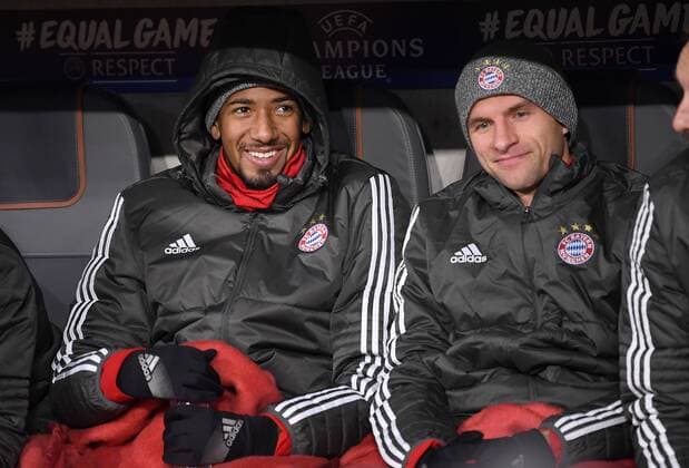 FOOTBALL CHAMPIONS LEAGUE SEASON 2017 2018 GROUP PHASE FC Bayern Munich Paris Saint Germain 05 12 2017 Thomas Mueller re and Jerome Boateng li both Bayern Munich are sitting at the beginning of the game only on the bench Muenchen