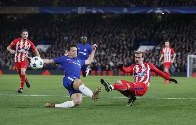 Antoine Griezmann of Atletico Madrid takes a shot on goal past Cesar Azpilicueta of Chelsea during the Champions League Group C match at the Stamford Bridge, London. Picture date: December 5th 2017. Picture credit should read: David Klein Sportimage EDITORIAL USE ONLY. No use with unauthorised audio, video, data, fixture lists, club league logos or live services. Online in-match use limited to 120 images, no video emulation. No use in betting, games or single club league player publications.