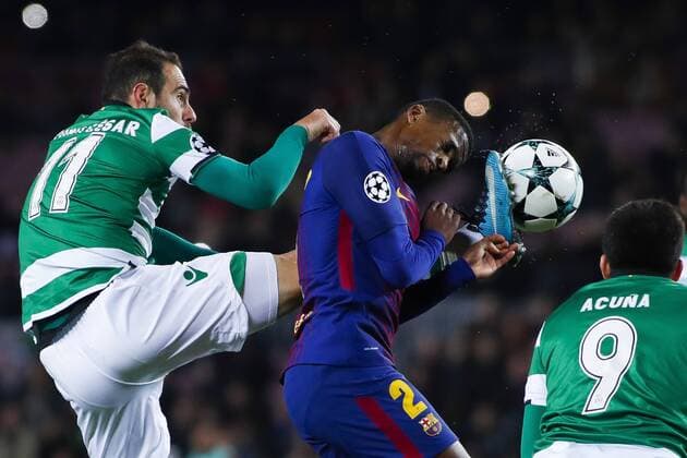5th December 2017, Camp Nou, Barcelona, Spain; UEFA Champions League football, FC Barcelona Barca versus Sporting Lisbon; Nelson Semedo of FC Barcelona receives the high boot foul from Bruno Cesar of Sporting Lisbon  ActionPlus11959318