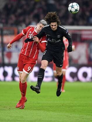 FOOTBALL CHAMPIONS LEAGUE SEASON 2017 2018 GROUP PHASE FC Bayern Muenchen Paris Saint Germain 05 12 2017 Robert Lewandowski left FC Bayern Muenchen against Adrien Rabiot re Paris Saint Germain Muenchen