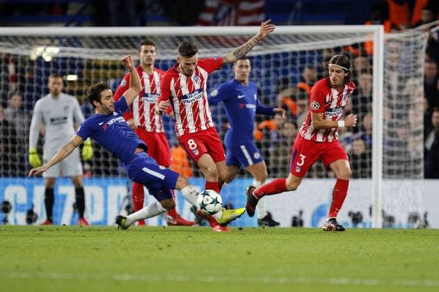 Cesc Fabregas of Chelsea FC tackles Lucas Hern‡ndez of AtlŽtico de Madrid during the UEFA Champions League match between Chelsea and Atletico Madrid at Stamford Bridge, London, England on 5 December 2017. Copyright: xCarltonxMyriex 18110037