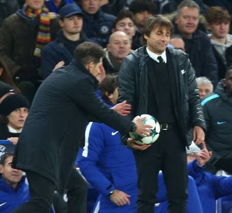 December 5, 2017 - London, England, United Kingdom - Diego Simeone manager of Atletico Madrid takes the ball from Chelsea manager Antonio Conte ..during the Champions League Group C match between Chelsea and Atletico Madrid at Stamford Bridge, London, England on 5 Dec 2017. Chelsea FC v Atletico Madrid - UEFA Champions League  - ZUMAn230 20171205_zaa_n230_446 Copyright: xKieranxGalvinx