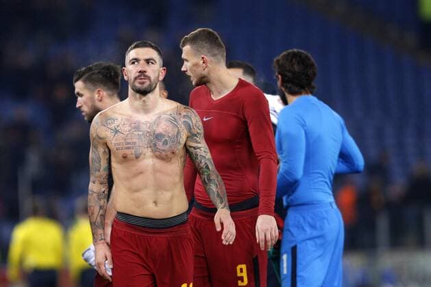 Italy: Soccer Champions League: Roma vs Qarabag Roma s Aleksandar Kolarov, left, and Edin Dzeko celebrate at the end of the Champions League Group C soccer match between Roma and Qarabag at the Olympic stadium. Roma won 1-0 to reach the round of 16. Rome Italy  RiccardoxDexLuca PacificxPress