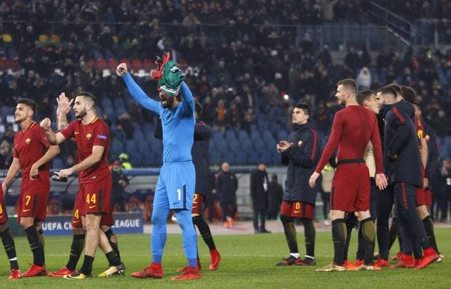 Italy: Soccer Champions League: Roma vs Qarabag Roma s players celebrate at the end of the Champions League Group C soccer match between Roma and Qarabag at the Olympic stadium. Roma won 1-0 to reach the round of 16. Rome Italy  RiccardoxDexLuca PacificxPress