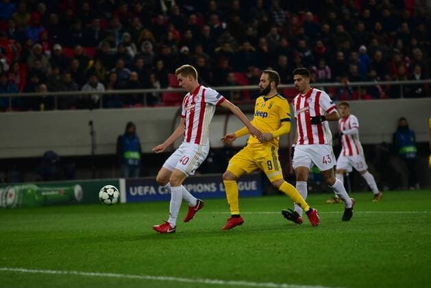 Greece: Champions League Olympiacos vs Juventus Effort of Gonzalo Higuain (no 9) of Juventus has stopped by Bjorn Engels (no 40) of Olympiacos. Athens Attiki Greece G. Karaiskakis Stadium  DimitriosxKarvountzis PacificxPress