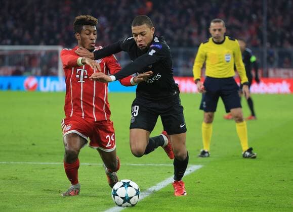(171206) -- MUNICH, Dec. 6, 2017 -- Kingsley Coman (L) of Bayern Munich competes with Kylian Mbappe of Paris Saint-Germain during a UEFA Champions League group B match between Bayern Munich and Paris Saint-Germain in Munich, Germany, Dec. 5, 2017. Bayern won 3-1. ) (SP)GERMANY-MUNICH-CHAMPIONS LEAGUE-BAYERN-PSG PhilippexRuiz 