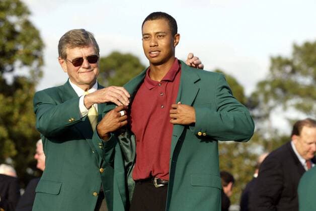 Hootie Johnson helps Tiger Woods into the Green Jacket Augusta Georgia U S A