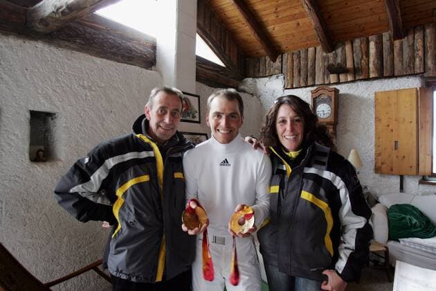 Michael Greis with 3 gold medals most successful athlete in the Olympic Games of Turin lived during the competitions in a rustic Italian farm about 500 metres from the biathlon Stadium located here is he with his father and his sister Isabelle San Sicario Italy